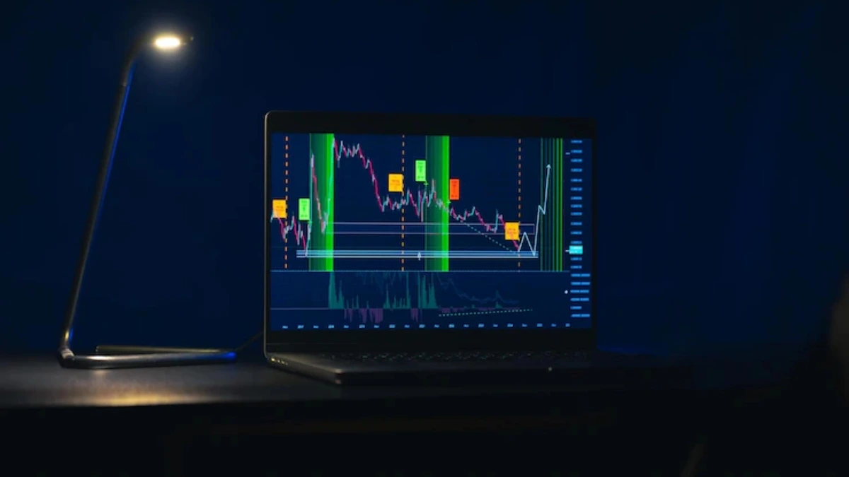 a laptop with a graph on the screen